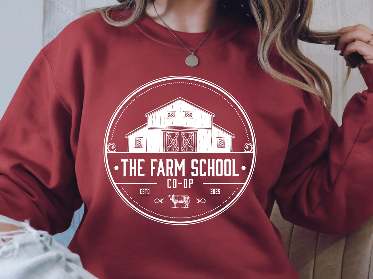 Red sweatshirt with white barn graphic and 'The Farm School Co-Op' text, rustic western style
