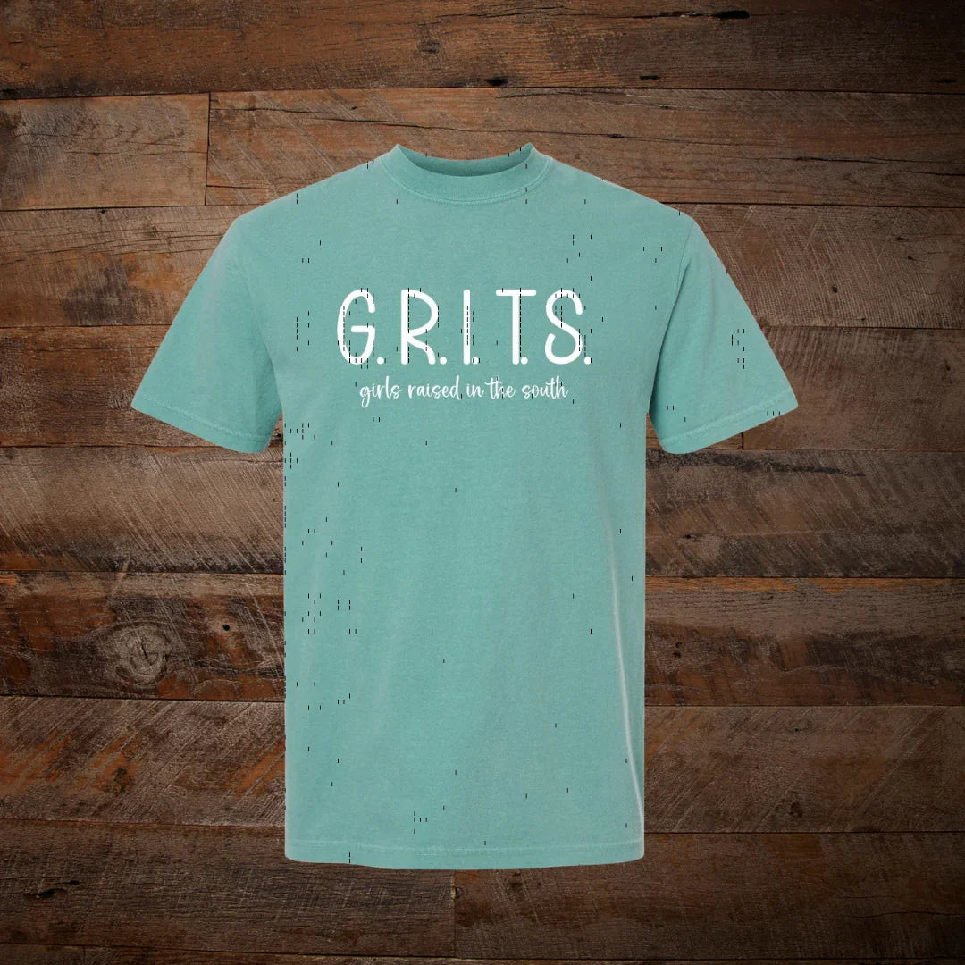 Mint green t-shirt with distressed look, white text G.R.I.T.S girls raised in the south