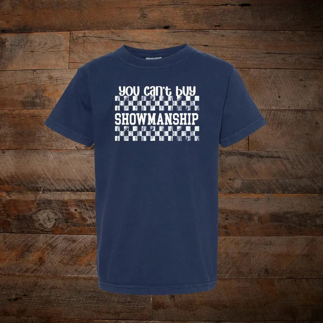 Navy blue t-shirt with 'You can't buy showmanship' text and checkered design on wood background