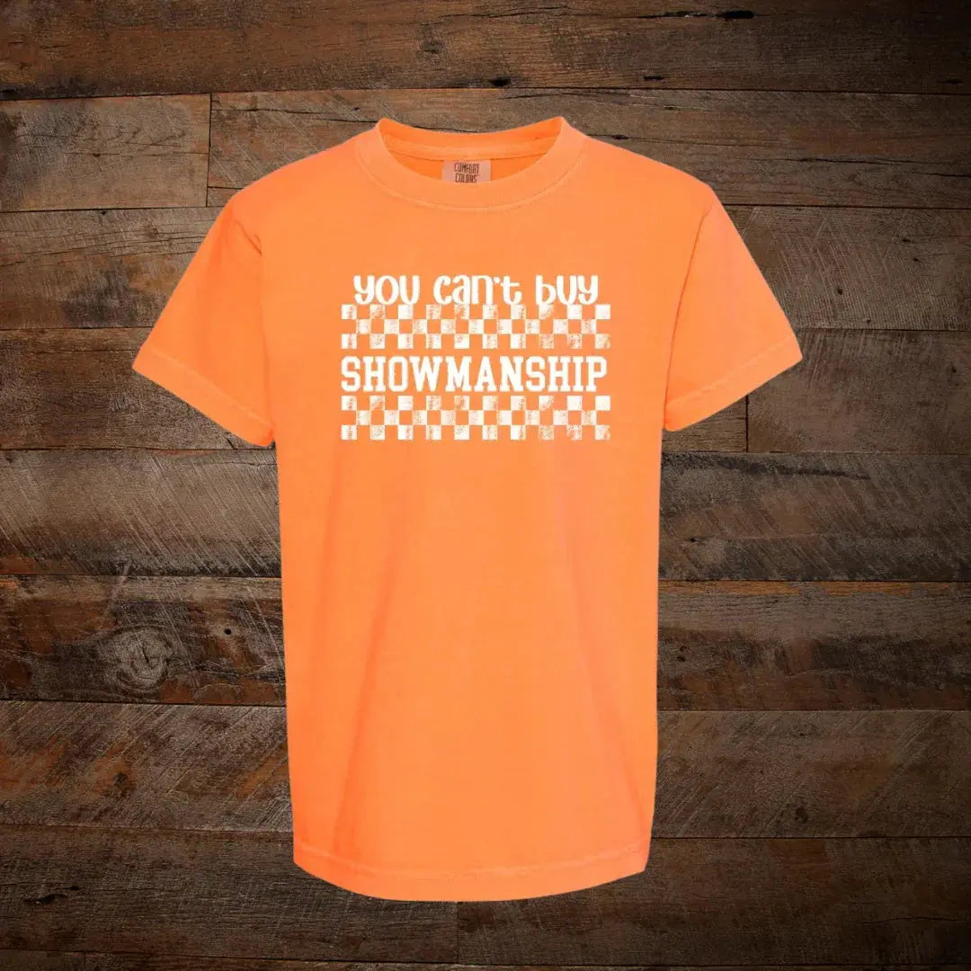 Orange t-shirt with white text that says 'You Can't Buy Showmanship' and checkerboard design