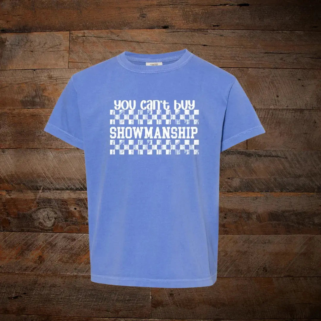 Blue graphic tee with 'You can't buy showmanship' text and checkered pattern, western style.