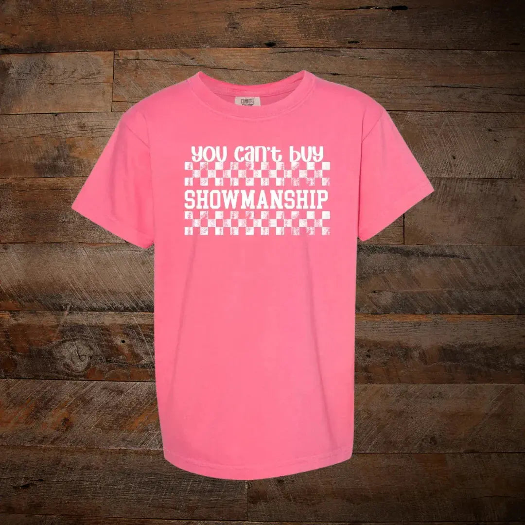 Pink graphic tee with 'You can't buy showmanship' text and white checkered design