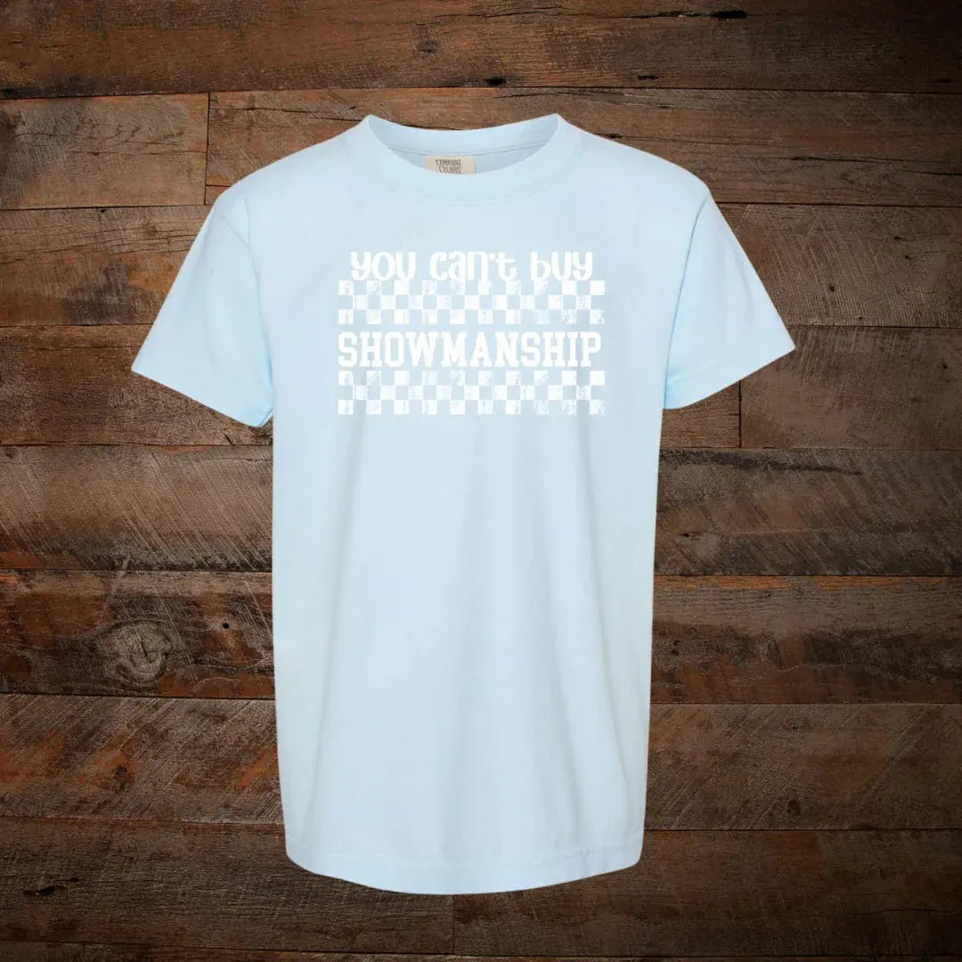 Light blue t-shirt with 'you can't buy showmanship' text and white checkered pattern