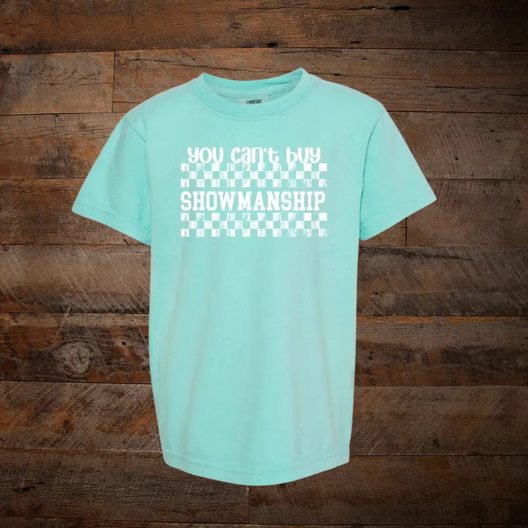 Mint green graphic t-shirt with white checkerboard and 'You Can't Buy Showmanship' text
